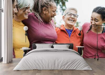 Happy multi generational women having fun together after sport workout outdoor - Focus on right woman face Wall mural