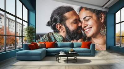 Indian husband and wife having tender moments - Portrait of happy southern asian couple - Love, ethnic and india's culture concept - Focus on woman eye Wall mural