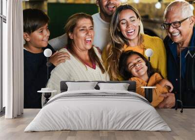 Portrait of happy latin family smiling on camera at home - Focus on grandmother face Wall mural