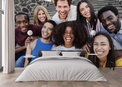 Young diverse people having fun outdoor laughing together - Diversity concept - Main focus on african girl face Wall mural