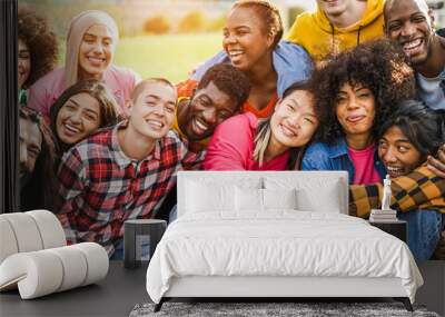 Young diverse people having fun outdoor laughing together - Focus on bald girl face Wall mural