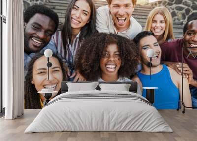 Young diverse people having fun outdoor laughing together - Focus on center african girl face Wall mural