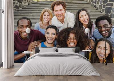 Young diverse people having fun outdoor laughing together - Focus on center african girl face Wall mural