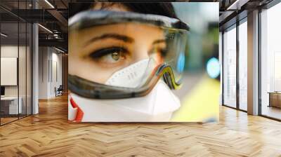 Macro eye view of sad female paramedic feeling alert with blue lights blinking Wall mural