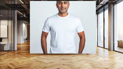 Mockup of a plain white t-shirt worn by a good looking middle aged Indian man Wall mural