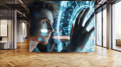 A man observes a high-tech interface with advanced digital graphics. Wall mural