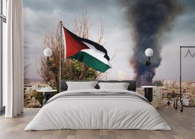 flag of Palestine on the mountain on the background of houses in the city.the war in the Middle East. explosion with black smoke in the city. Wall mural