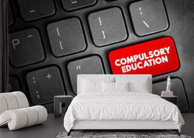 Compulsory education, text button on keyboard, concept background Wall mural