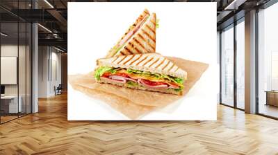 Sandwich with ham, cheese, tomatoes, lettuce, and toasted bread. Above view isolated on white background. Wall mural