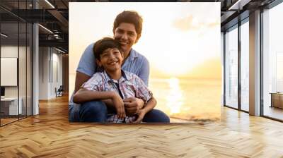 Loving Father Embracing Son at Golden Sunset Beach Wall mural