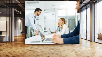 Businessman lecture to his colleagues at presentation in the con Wall mural