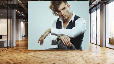 Fashionable man posing in the studio Wall mural