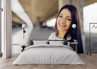 Portrait of a young woman with a beautiful smile on her face Wall mural