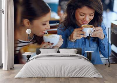 Three young women enjoy coffee at a coffee shop Wall mural