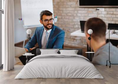 Two business men talking in the office Wall mural