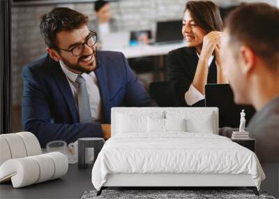 Young business couple signing a contract Wall mural