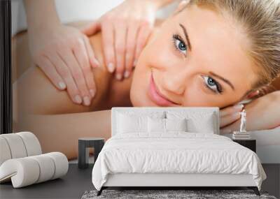 Young woman having massage on spa treatment Wall mural