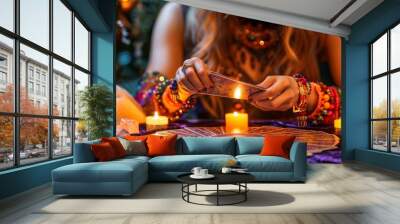 A mystic scene with a person reading tarot cards surrounded by candles and crystals, conveying a sense of spirituality and intuition. Wall mural