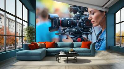 Radiant female filmmaker adjusts professional camera on set with a cheerful demeanor Wall mural