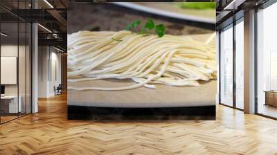 Handmade traditional Chinese thick wheat flour noodles on a plate  Wall mural