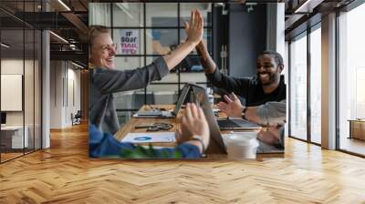 A manager recognizing and appreciating an employee hard work and contributions in a team meeting showcasing the positive impact of acknowledgment and support on mental well-being Wall mural