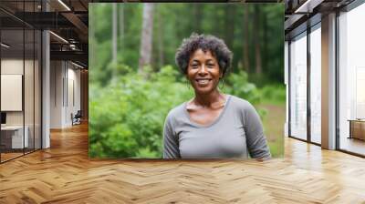 Studio shot of a beautiful mature black woman looking at the camera on gray background Wall mural