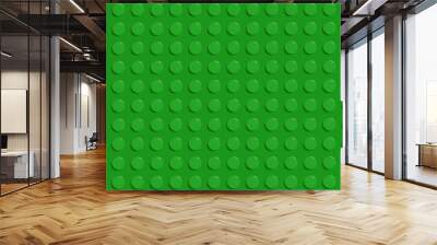 Green plastic construction plate with black circles, geometric circle green wallpaper, seamless modern design abstract background, closeup plastic toy block, abstract 3d round spheres Wall mural