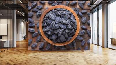 blue raisins, dried grapes in wooden bowl, top view. Wall mural