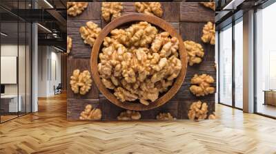 walnut peeled in wooden bowl, top view. Wall mural