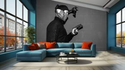 Soldier in a mask with a night vision device and a gun, black and white photo. Wall mural