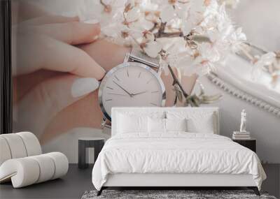 Beautiful elegant classic white watch on woman hand. Close-up photo. Wall mural