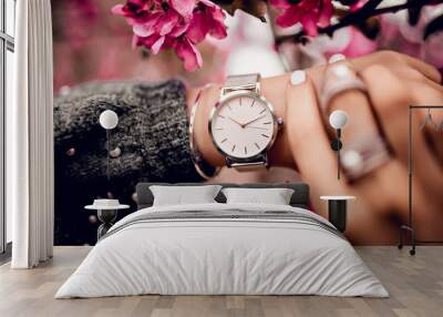 Beautiful silver watch on woman hand Wall mural