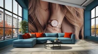 Beautiful white golden watch on woman hand Wall mural