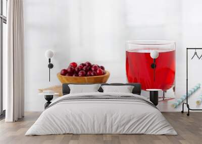 Glass with fresh organic cranberry juice and red cranberries. Wall mural