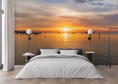 Beautiful red and orange sunrise over the sea. Wall mural