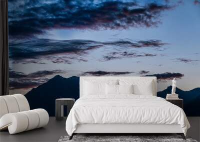 Silhouette of mountain range at sunset Wall mural