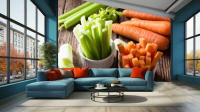 The sticks of carrots and celery on wooden table. Wall mural