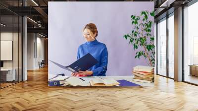 business woman 40 years old at a desk in the office office Wall mural