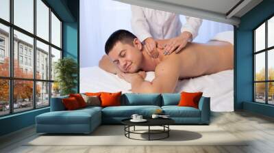 man doing medical massage and body treatments at the Spa Wall mural