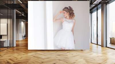 pretty girl in a short white wedding dress Wall mural