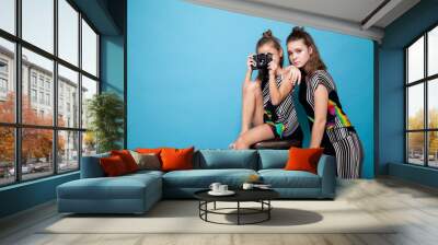 two stylish girls photographed retro camera Wall mural