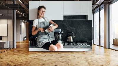 woman housewife prepares sweet dessert cakes for cooking Wall mural