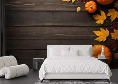 Autumn background with pumpkins and fall leaves on brown wood Wall mural