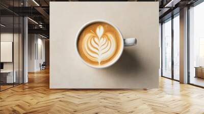 Close-up overhead shot of a cup of coffee with latte art Wall mural