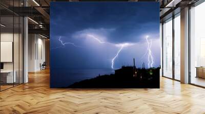 Powerful thunderstorm over a small town Wall mural