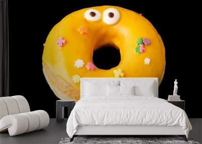 Donut with yellow icing and confetti with eyes Wall mural