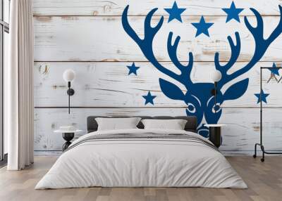 Festive Merry Christmas blue color logo featuring a reindeer and stars against a white wooden background, copy space Wall mural