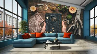 fortune teller woman reading a book of future concept. Wall mural