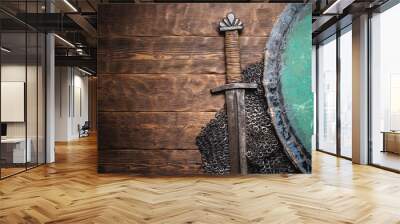 Medieval concept flat lay background. Sword and shield background with copy space. Wall mural