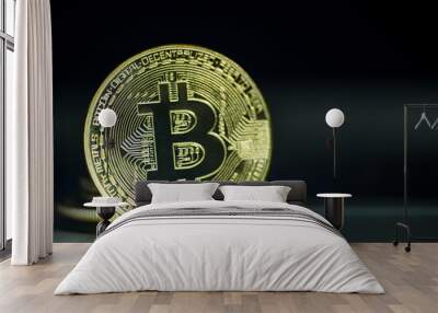 Shiny gold bitcoin on dark background  Wall mural